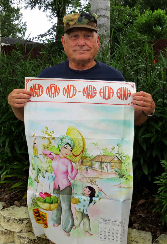 AuthorHoldsTetPoster.jpg (238786 bytes)